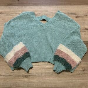 Cozy oversized light blue sweater with fuzzy detailing on sleeves.